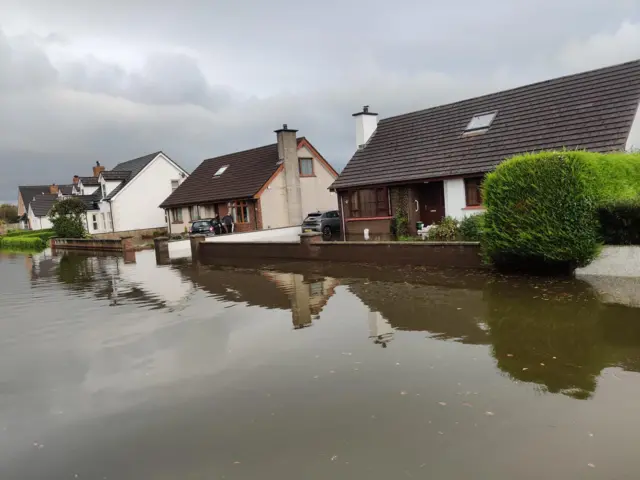 Row of houses on a flooded road