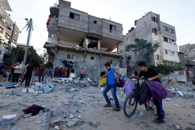 The aftermath of an Israeli strike in Khan Younis, as seen on Monday