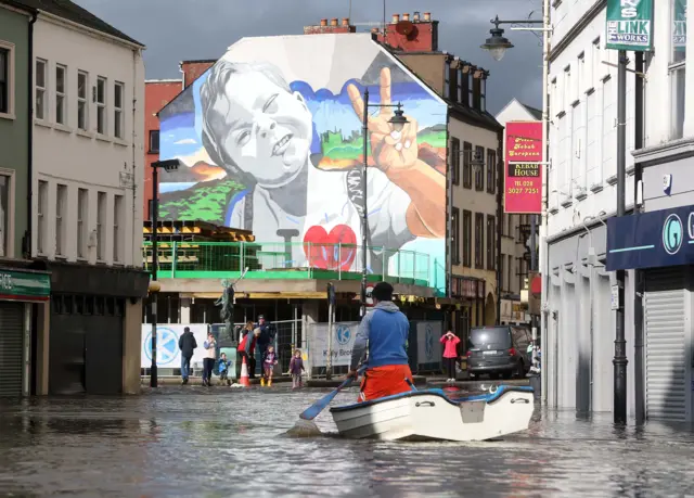 Man on boat in Newry flood