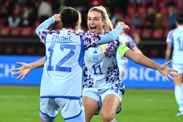 Oihane Hernandez (L) is congratulated by Spain's midfielder #11 Alexia Putellas