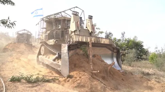 An Israeli bulldozer inside Gaza, from footage released by the IDF