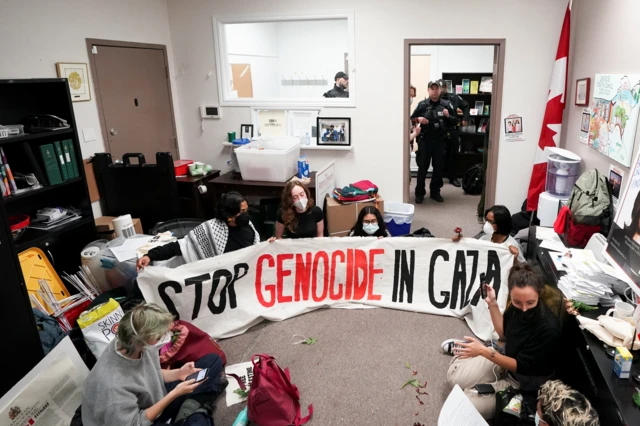 Protesters occupy an office