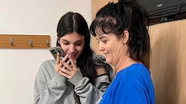 President Biden released a photo of Judith and Natalie Raanan speaking with him on the phone after their release