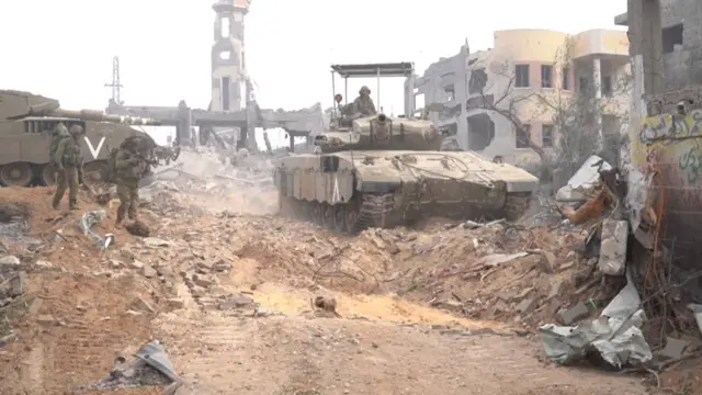 An Israeli tank moves through Gaza, in footage supplied by the IDF