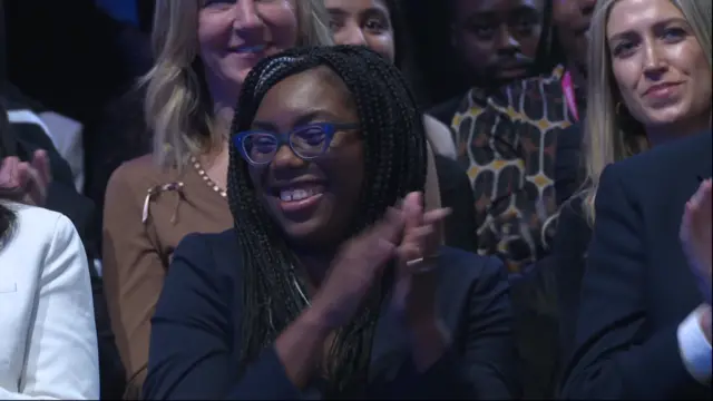 Kemi Badenoch smiles from the audience