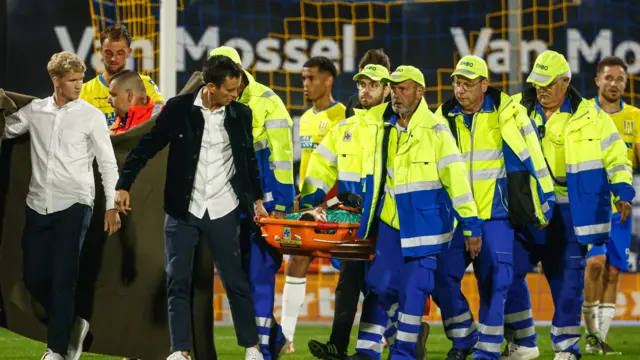 Etienne Vaessen being stretchered off pitch