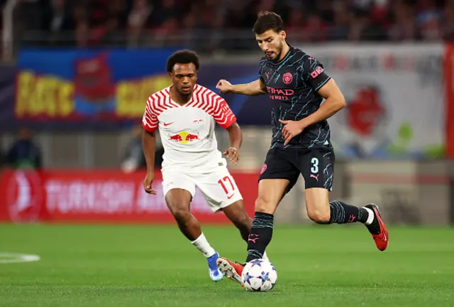 Ruben Dias of Manchester City runs with the ball