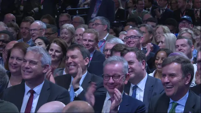 Steve Barclay, Michael Gove and Greg Hands laugh in the audience