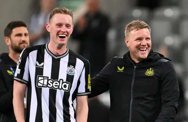 Sean Longstaff and Eddie Howe smile after the final-whistle