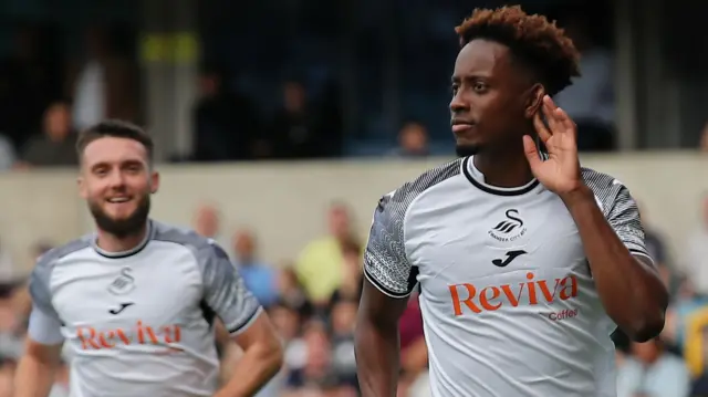 Jamal Lowe (right) celebrates scoring for Swansea City against Millwall