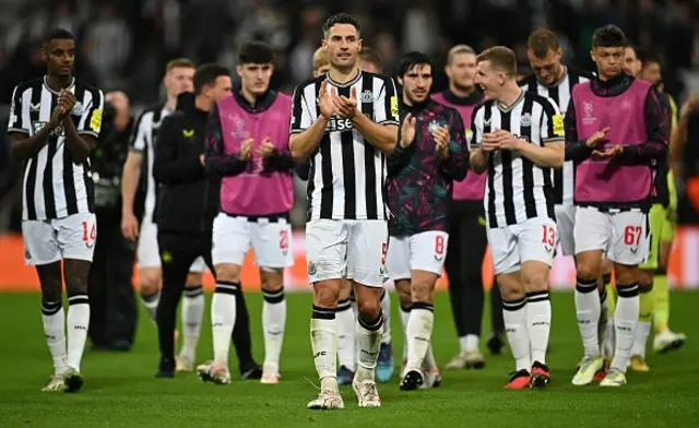 Newcastle United's Swiss defender Fabian Schar reacts after the game with teammates