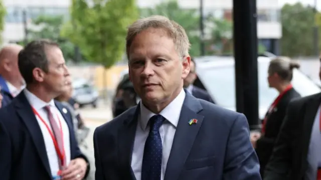 British Secretary of State for Defence Grant Shapps (C) arrives at the Conservative Party Conference in Manchester, Britain, 02 October 2023.