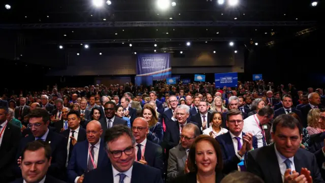 Audience members attend the Britain's Conservative Party's annual conference