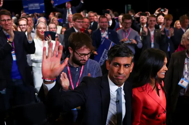 Sunak waves as he leaves conference hall