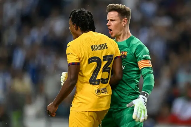 Barcelona's French defender Jules Kounde and Barcelona's German goalkeeper Marc-Andre ter Stegen