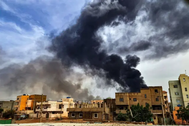 Smoke plumes billow from a fire at a lumber warehouse in southern Khartoum amidst ongoing fighting on June 7, 2023.