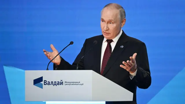 President Putin addressing the conference in Sochi