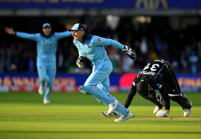 Jos Buttler celebrates running out Martin Guptill of New Zealand to win the Cricket World Cup final in 2019