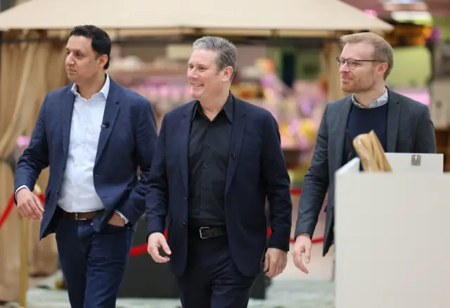 Labour leader Sir Keir Starmer with Scottish Labour leader Anas Sarwar and Labour candidate for the possible Rutherglen and Hamilton West by-election Michael Shanks (right) during a visit to Rutherglen