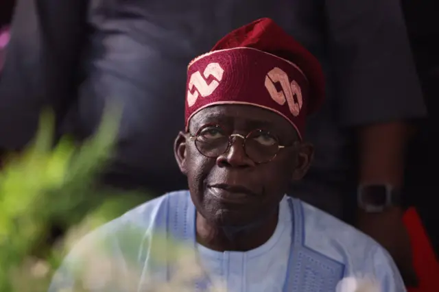 Ruling party candidate Bola Tinubu, looks on in Abuja on March 1, 2023 during celebrations at his campaign headquarters. - Ruling party candidate Bola Tinubu won Nigeria's highly disputed weekend election, electoral authorities said on Wednesday, securing the former Lagos governor the presidency of Africa's most populous democracy.