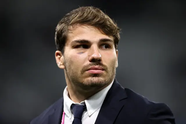 Antoine Dupont of France looks on as he inspects the pitch