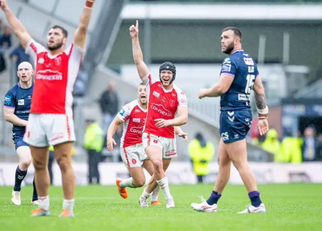 Hull KR's Brad Schneider celebrates kicking the game-winning drop goal in Golden Point against Wigan