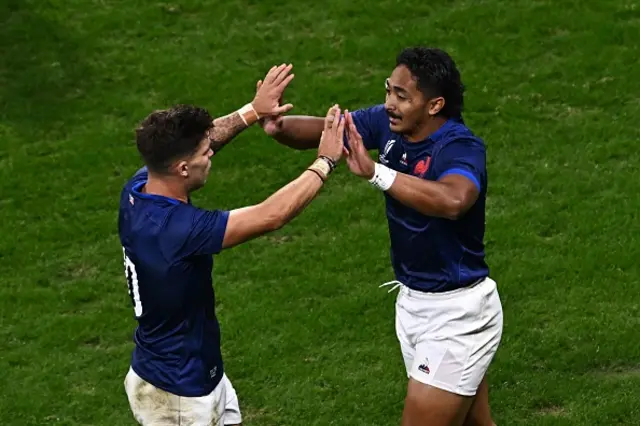 France's centre Yoram Moefana celebrates with France's fly-half Matthieu Jalibert