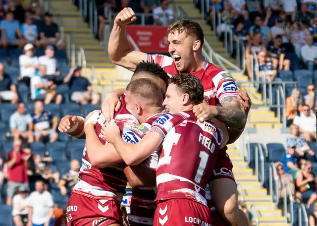 Wigan's Sam Powell celebrates Kai Pearce-Paul's try against Leeds