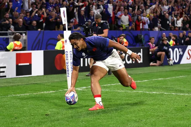 Yoram Moefana of France puts the ball down to score