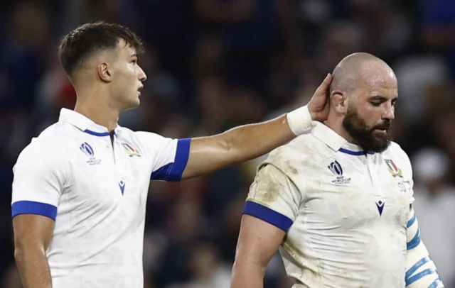 Italy's Simone Ferrari reacts WITH A TEAMMATE after disallowed try