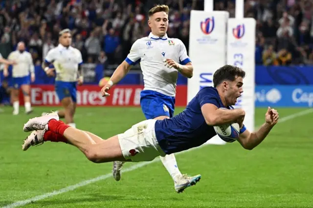 Damian Penaud of France scores anther try as he dives over