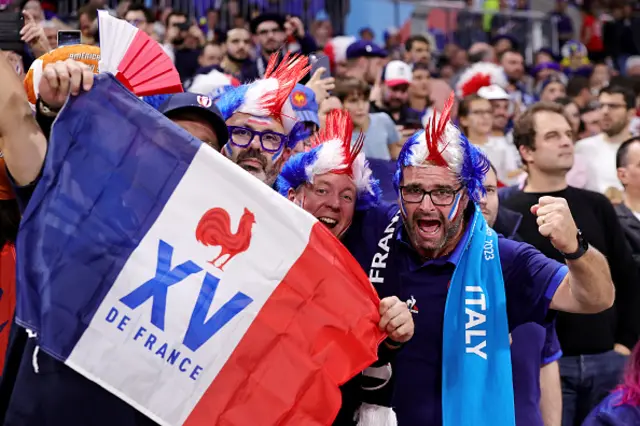 Fans of France pose for a photo