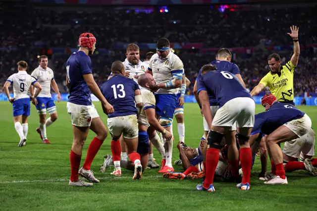 Italian players get off the ground after scoring - disallowed try