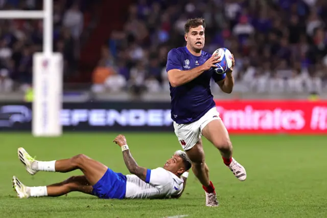 Damian Penaud of France runs with the ball during the game