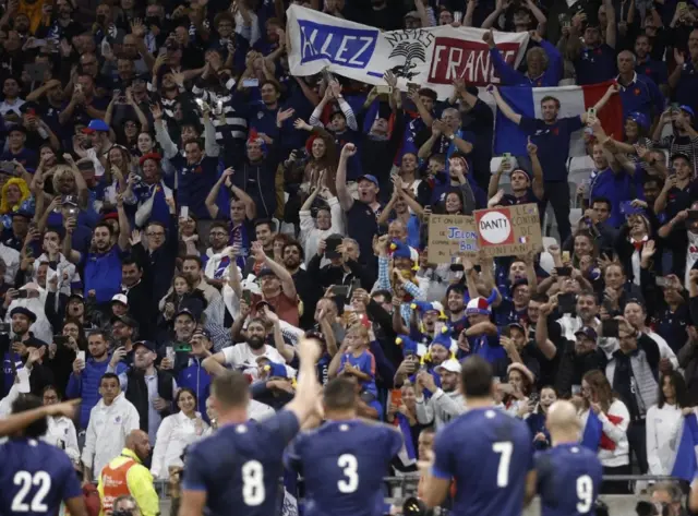 Players applaud French fans in the stadium