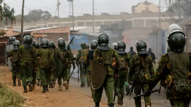 Riot police officers carry weapons and shields, as supporters of Kenya's opposition leader Raila Odinga of the Azimio La Umoja (Declaration of Unity) One Kenya Alliance participate in an anti-government protest against the imposition of tax hikes by the government in Nairobi, Kenya July 19, 2023.