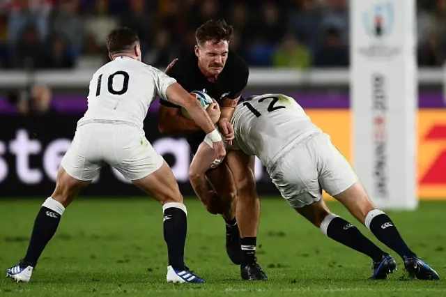 George Ford and Owen Farrell tackle an opposition player