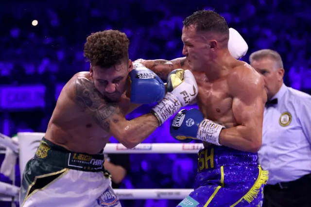 Leigh Wood is punched by Josh Warrington