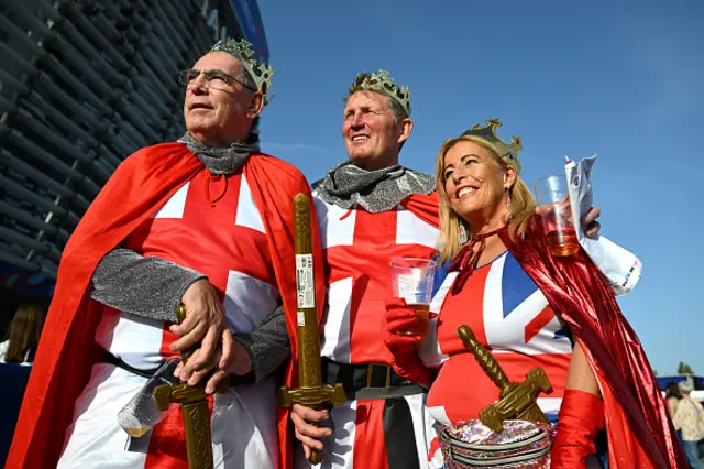 England fans in fancy dress smile for pictures