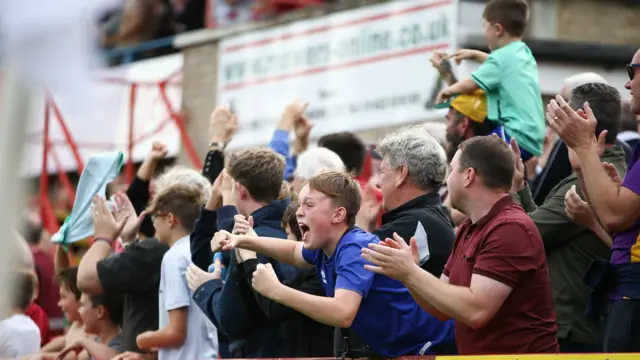 Cheltenham fans celebrate first goal of season