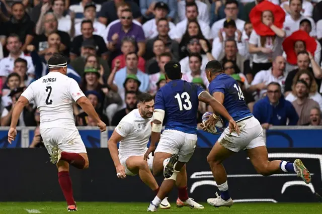 Samoa's wing Nigel Ah Wong runs on his way to scoring a try as Johnny May attempts a tackle