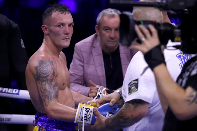 Josh Warrington has his gloves taken off by his coach