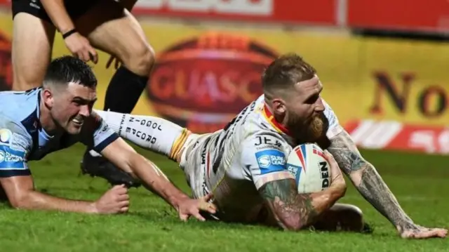 Sam Tomkins scores a try for Catalans Dragons against St Helens