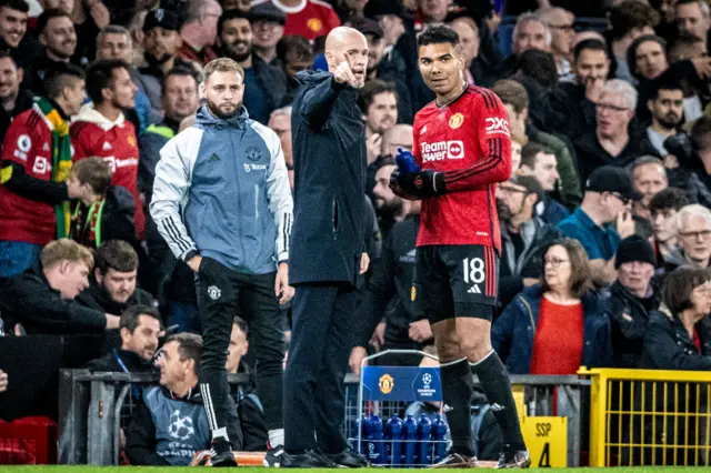 Casemiro is given instructions by Erik ten Hag.