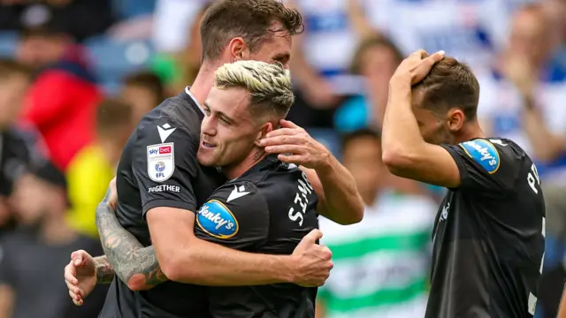 Blackburn celebrate scoring a fourth goal at QPR