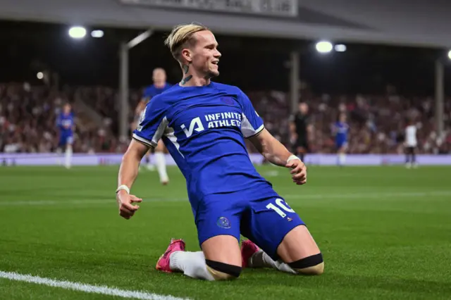 Mudryk knee slides in celebration of his goal at Fulham.