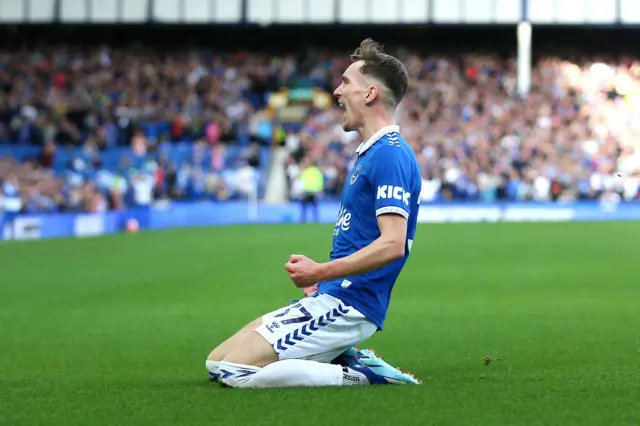 Garner knee slides in celebration of his goal for Everton.