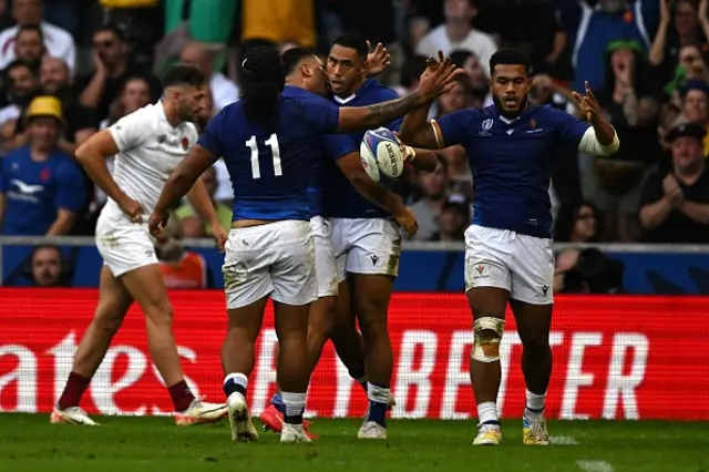 Samoa's wing Nigel Ah Wong is congratulated by teammates