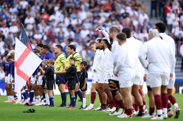 Owen Farrell of England looks on