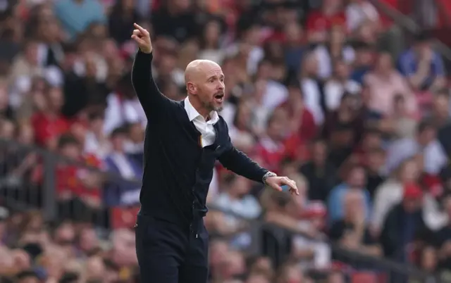 Ten Hag shouts and points instructions to his side.